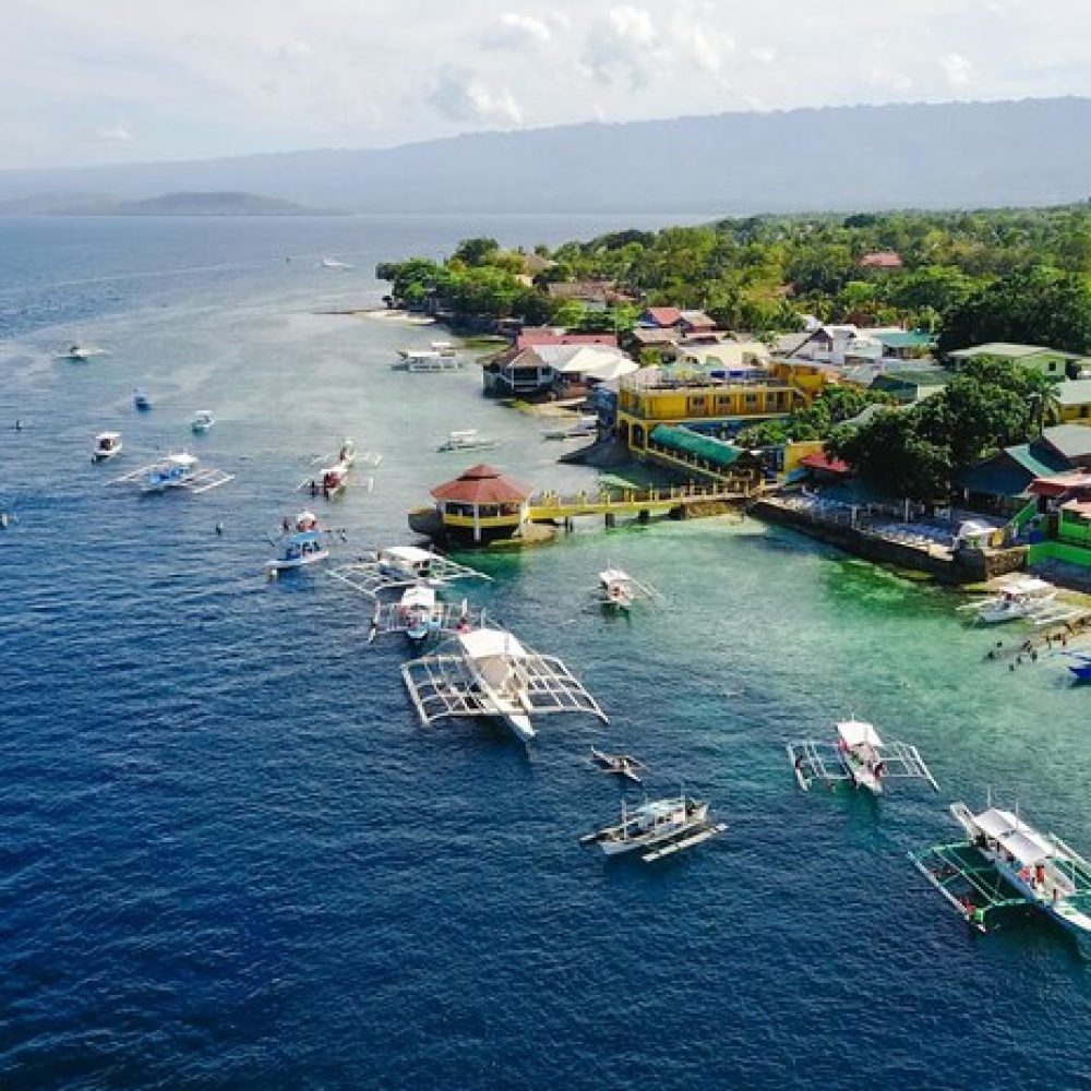 aerial-view-sandy-beach-with-tourists-swimming-beautiful-clear-sea-water-sumilon-island-beach-landing-near-oslob-cebu-philippines-boost-up-color-processing_1253-895 aerial-view-sandy-beach-with-tourists-swimming-beautiful-clear-sea-water-sumilon-island-beach-landing-near-oslob-cebu-philippines-boost-up-color-processing_1253-895